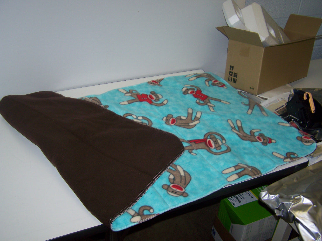 Blanket with monkey pattern on a table